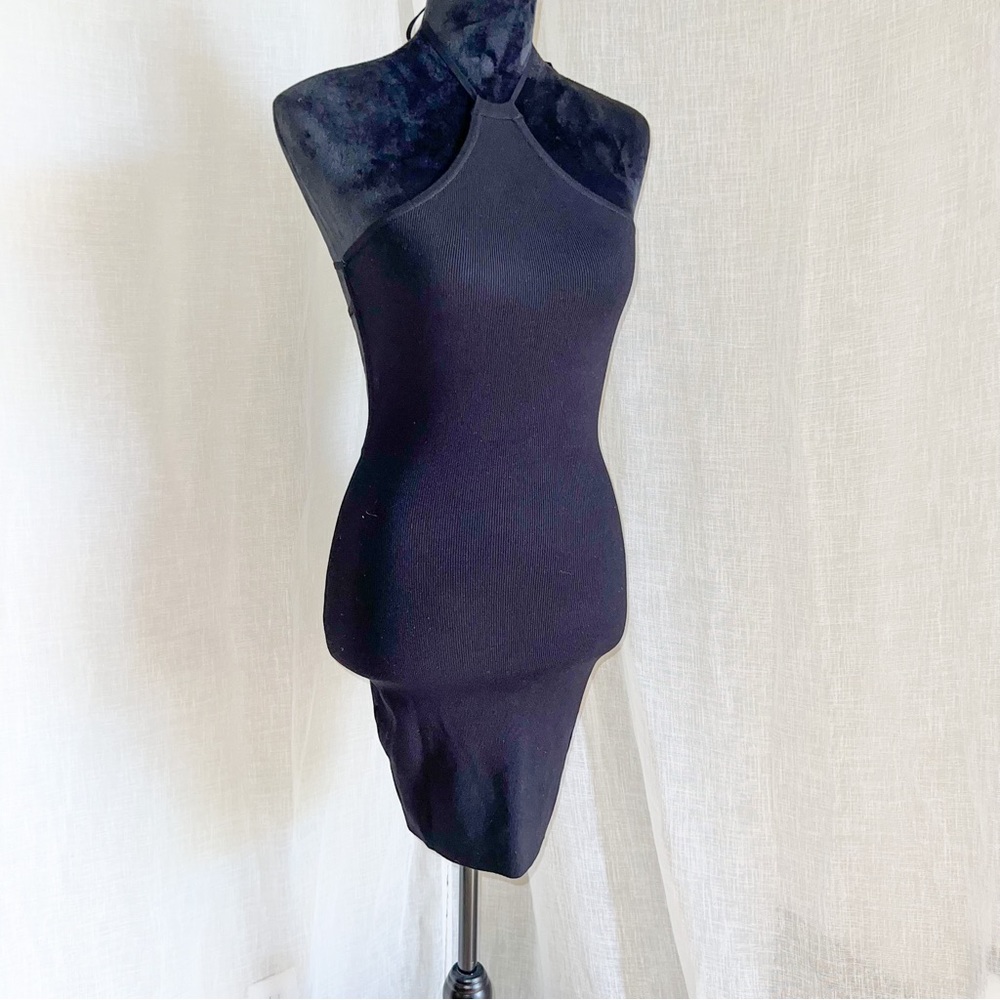 Black 90s Low Back Dress with Gold Clasps.
